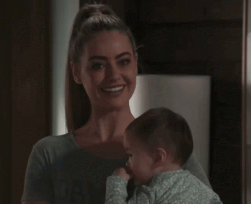 Woman Holding Baby Smiling GIF