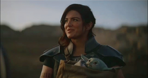 Woman Holding Baby Yoda
