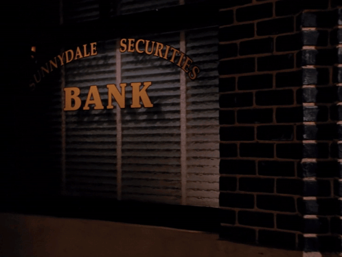 Woman Holding Bag in Front of Innydale Securities Bank