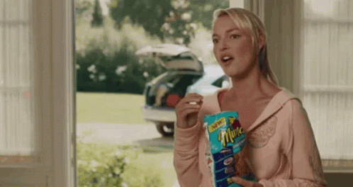 Woman Holding Bag of Chips