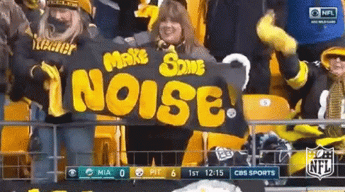 Woman Holding Banner Saying Make Some Noise GIF