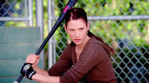 Woman Holding Baseball Bat With Easton Glove