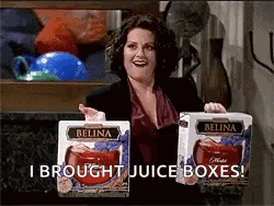Woman Holding Belina Juice Boxes Says I Brought