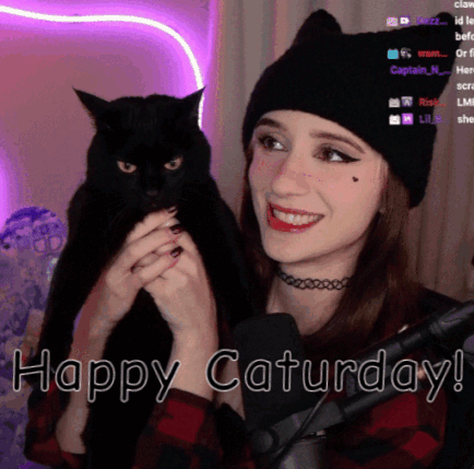 Woman Holding Black Cat at Microphone Happy Saturday