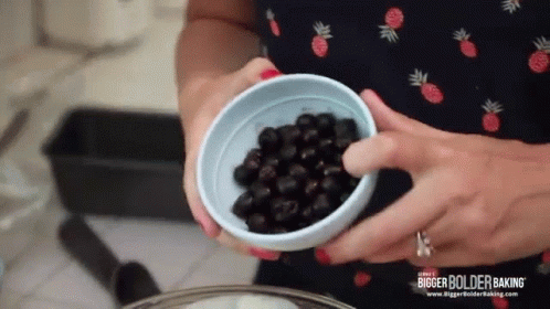 Woman Holding Blue Bowl of Blackberries