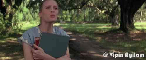 Woman Holding Book in Park