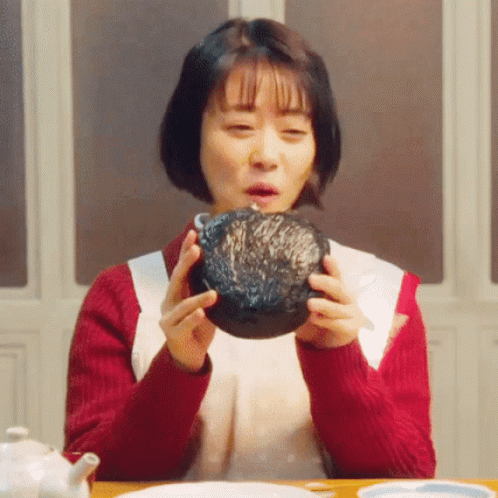 Woman Holding Bowl of Food