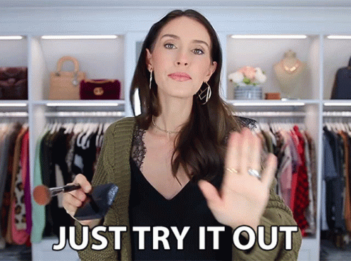 Woman Holding Brush Says Try It Out GIF