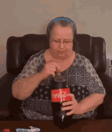 Woman Holding Bursing Coke Bottle GIF