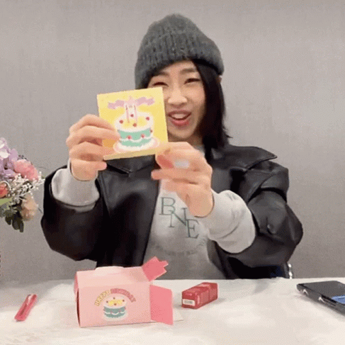 Woman Holding Card With Cake