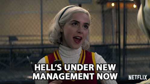 Woman Holding Cell Phone Hell Under New Management