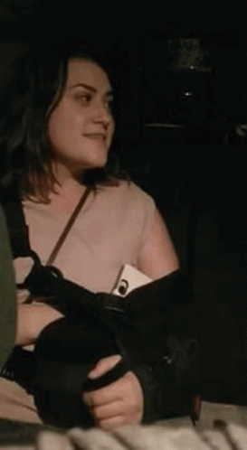 Woman Holding Cell Phone in Back Seat