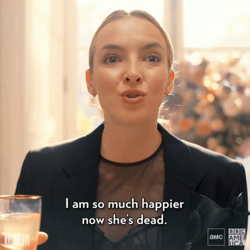 Woman Holding Champagne Saying I Am So Much Happier Now She's Dead GIF