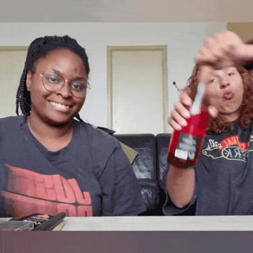 Woman Holding Coca Cola Beside A Shirt Woman