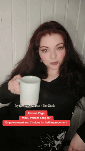 Woman Holding Coffee Femme Rage Vibe
