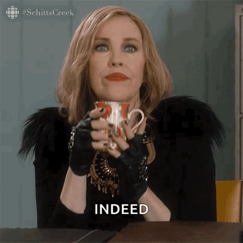Woman Holding Coffee With Indeed