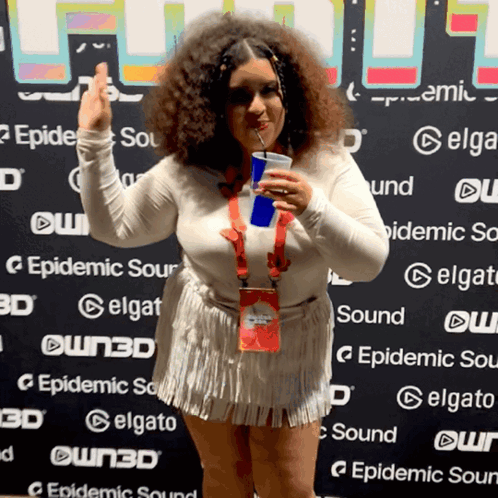 Woman Holding Drink in Front of Epidemic Sour Wall