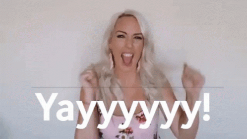 Woman Holding Fist And Saying Yay GIF