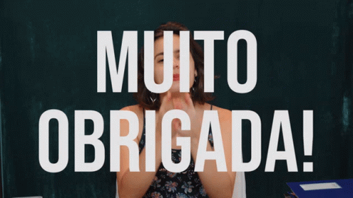 Woman Holding Fist In Front Of Muito Obrigada Sign GIF