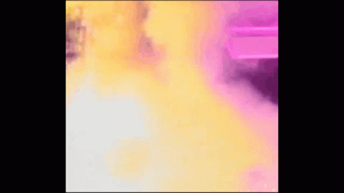 Woman Holding Flag In Front Of Explosion GIF