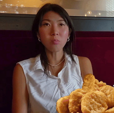 Woman Holding Fried Food GIF
