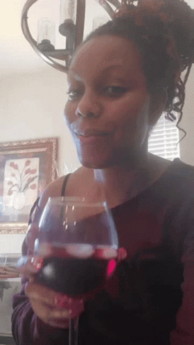 Woman Holding Glass of Red Wine
