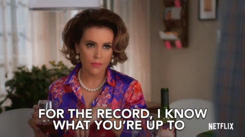 Woman Holding Glass of Wine Says For the Record I Know What You're Up to Netflix