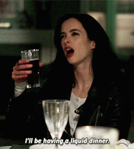 Woman Holding Glass Saying I'll Be Having a Liquid Dinner