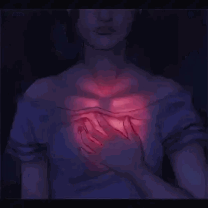 Woman Holding Glowing Heart
