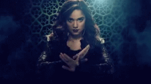 Woman Holding Glowing Object GIF