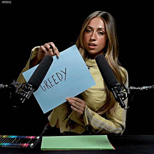 Woman Holding Greedy Paper