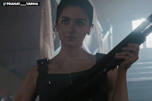 Woman Holding Gun at Pranay Sign
