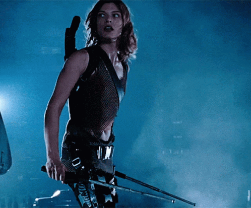 Woman Holding Gun With Tokyo On Belt GIF