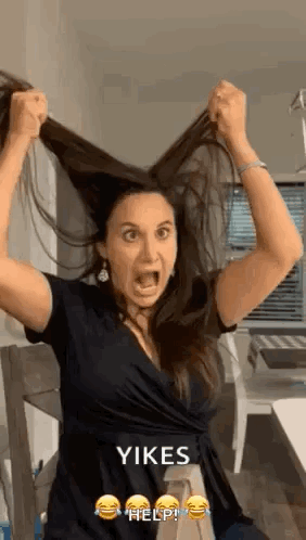 Woman Holding Hair in Air With Mouth Open