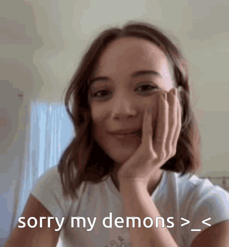Woman Holding Hand to Face Saying Sorry My Demons