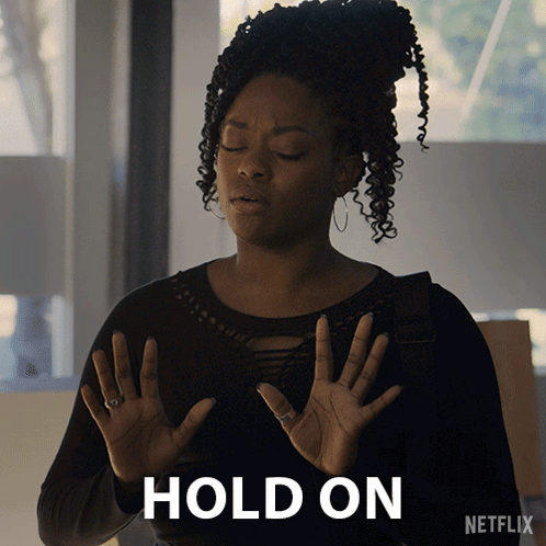 Woman Holding Hands Up At Netflix Logo GIF