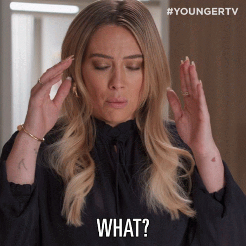 Woman Holding Head And Saying What GIF