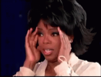 Woman Holding Head In Pain On TV Show GIF