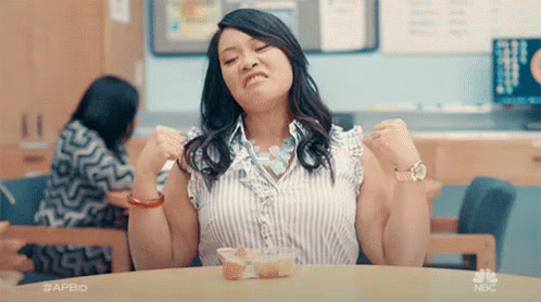 Woman Holding Head In Pain On TV Show GIF