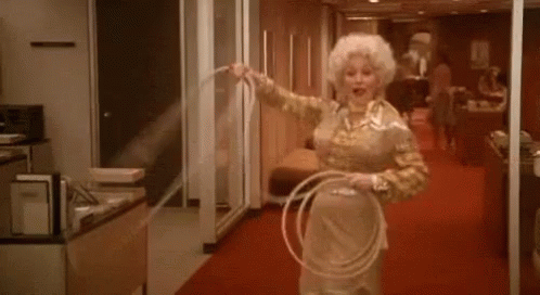Woman Holding Hula Hoop in Hallway