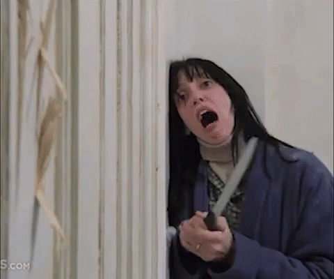 Woman Holding Knife In Front Of Door GIF