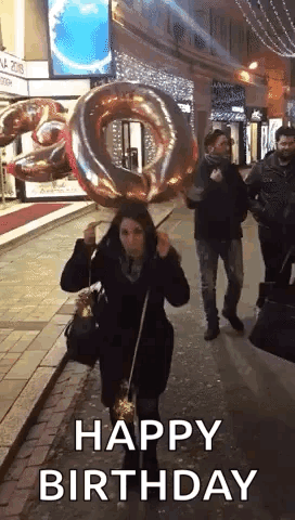 Woman Holding Large Balloon And Sparkler GIF