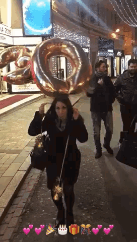 Woman Holding Large Number 10 Balloon Over Head
