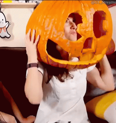 Woman Holding Large Pumpkin on Head