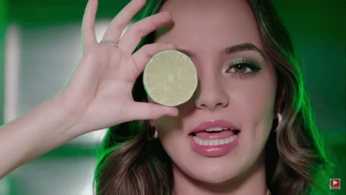 Woman Holding Lime Slice Over Eye