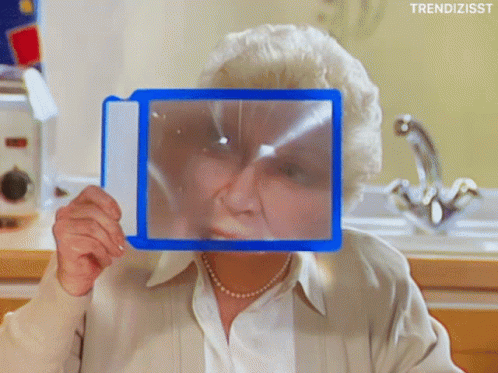 Woman Holding Magnifying Glass