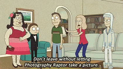 Woman Holding Man's Arm In Living Room With Cartoon Characters GIF