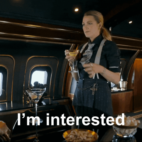 Woman Holding Martini Glass Interested