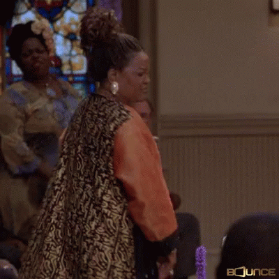 Woman Holding Microphone at Stained Glass Window Juju