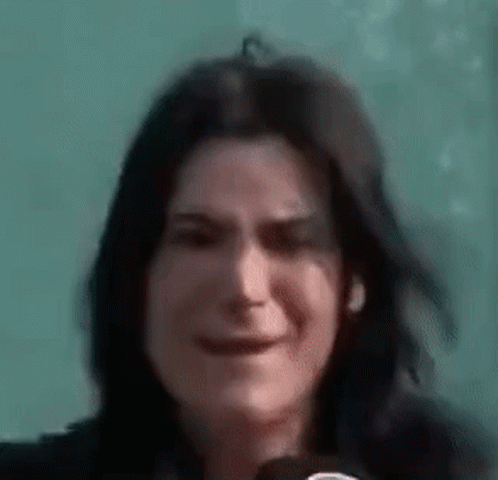 Woman Holding Microphone Close Up